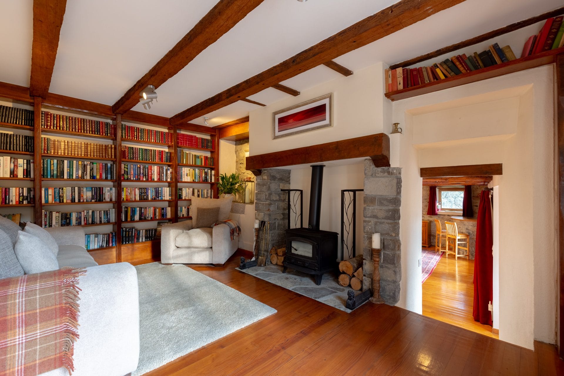 Library with wood stove and books to read everywhere